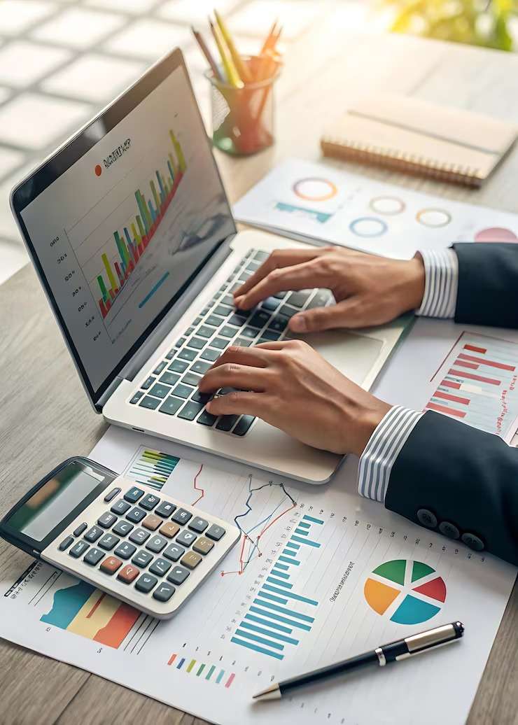 imgi_23_person-typing-laptop-with-graph-top_1336851-5449