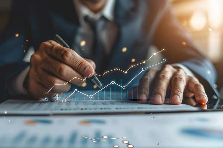 imgi_34_man-is-typing-tablet-with-graph-graph-him_939033-38242